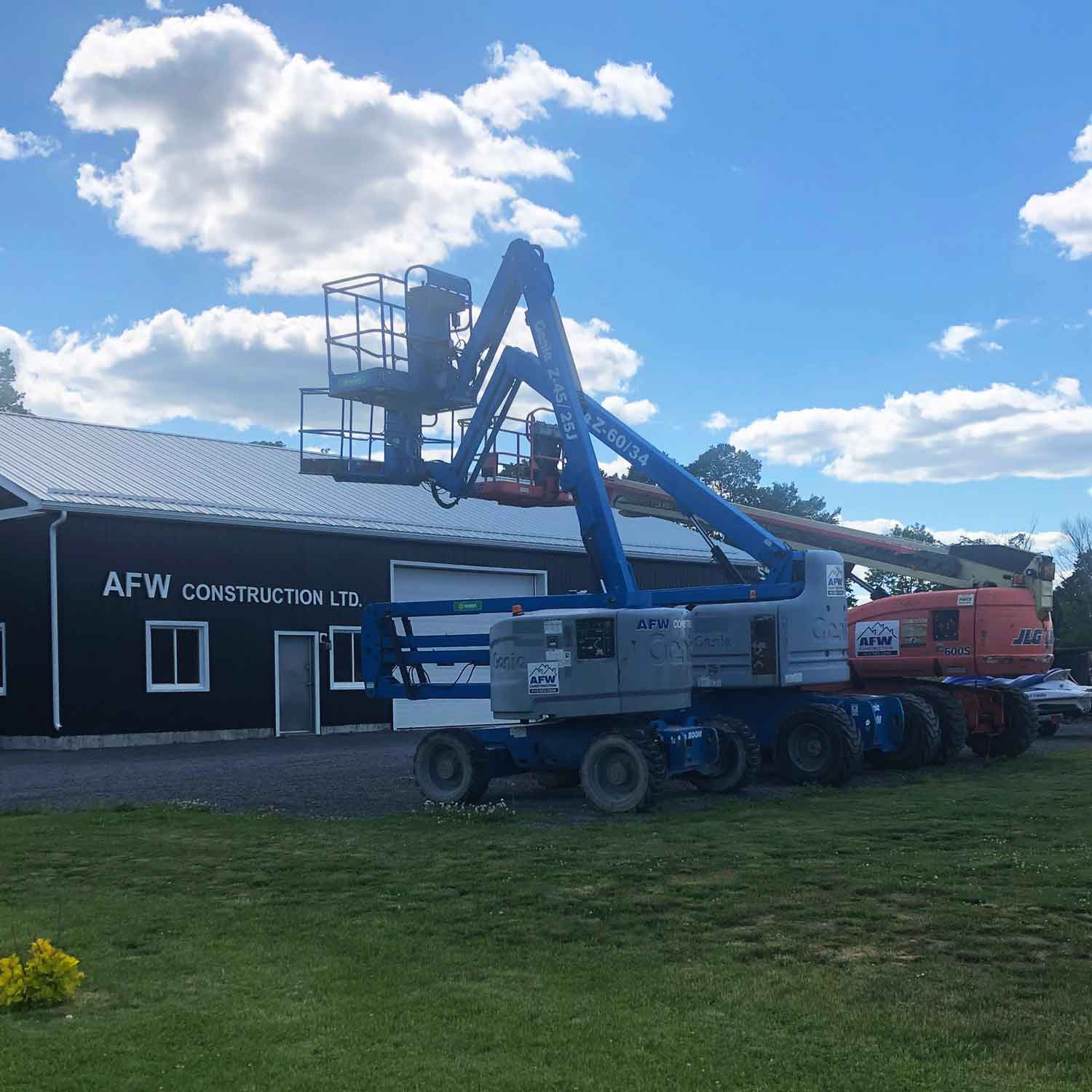 Lifts parked outside AFW Construction's shop