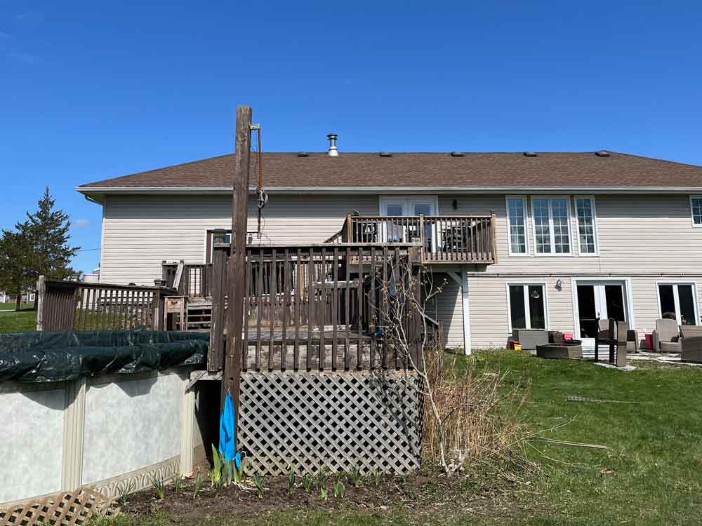Old deck leading from house to pool