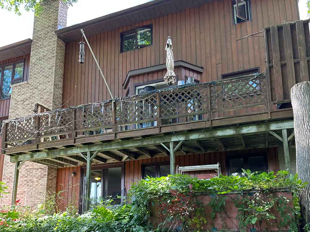 Deck before transformation. Old lattice railings