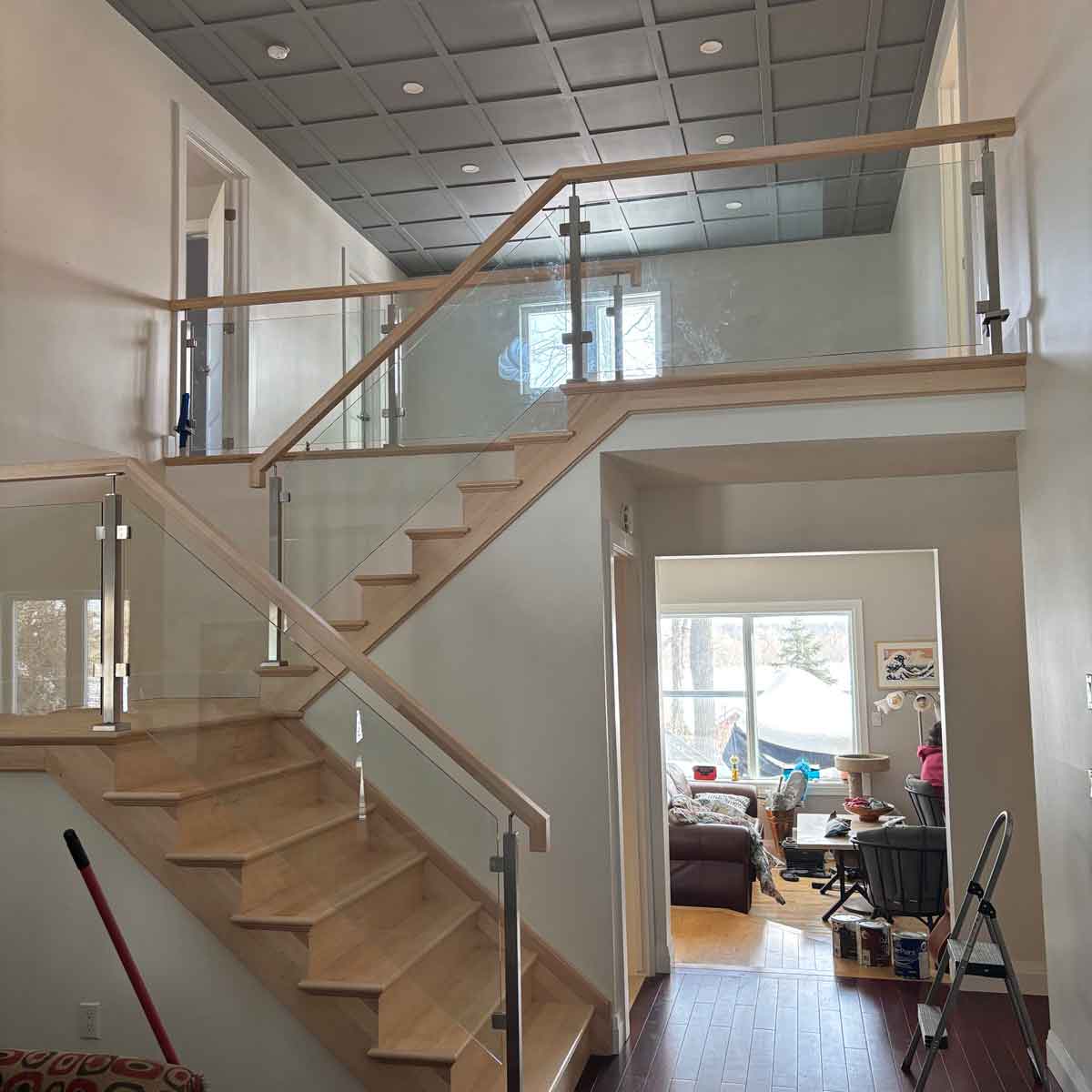 Stairs and railing installed in a home.